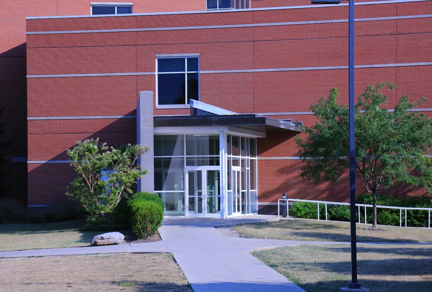 red brick style building exterior with glass doors