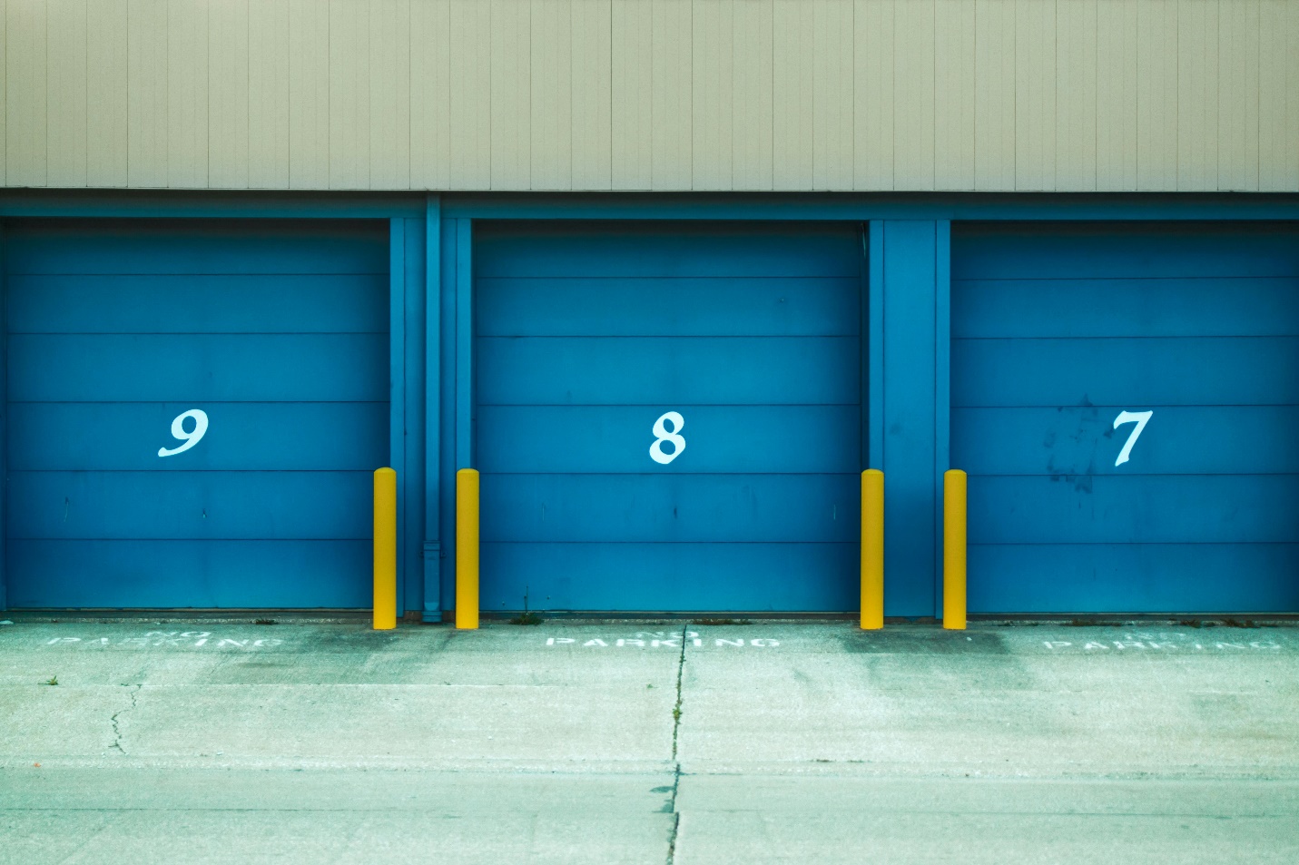 three garage doors side by side 